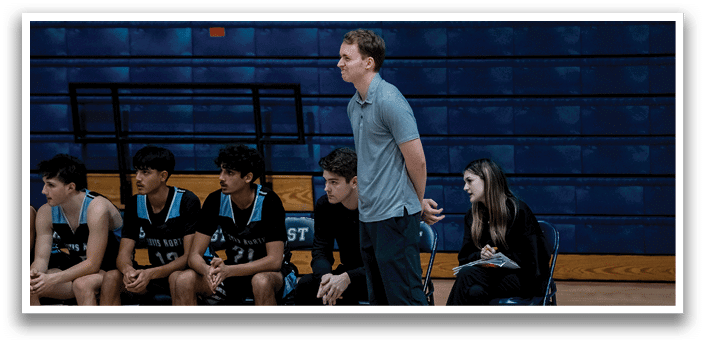 A group of people, including a man and a woman, are sitting on chairs in a gym. AI generated content
