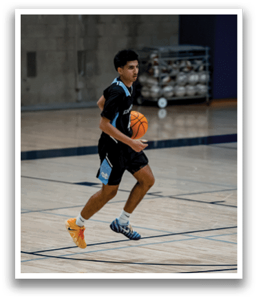 A man in a basketball court holding a basketball. AI generated content