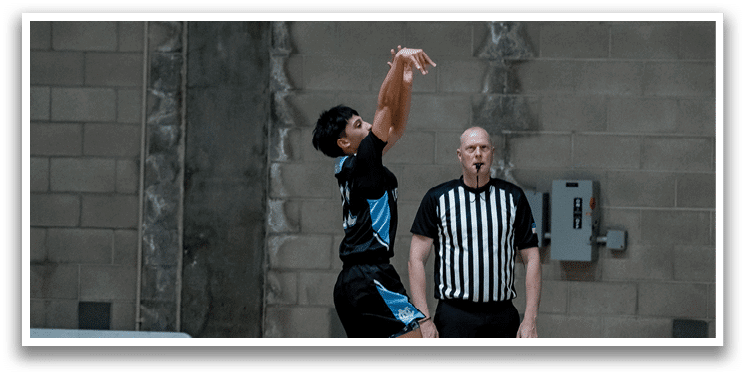 A man in a black shirt and white pants is jumping in the air to catch a basketball. AI generated content