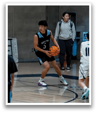 A group of people playing basketball, one of them holding a basketball. AI generated content