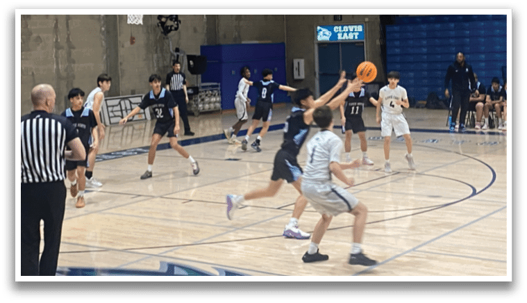 A group of people playing basketball on a court. AI generated content