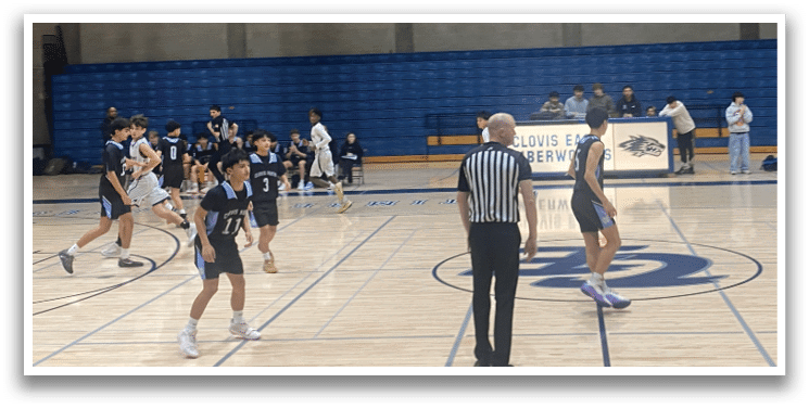 A group of people playing basketball on a court. AI generated content