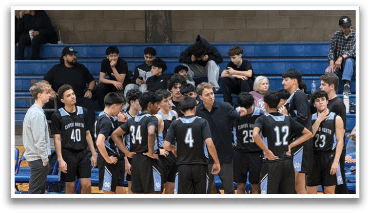 A group of young men wearing black jerseys are standing on a basketball court. AI generated content