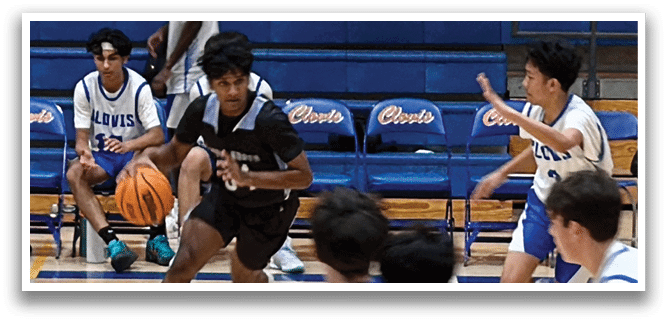 A group of young men playing basketball on a court. One player is running with a basketball, while others are chasing him. AI generated content