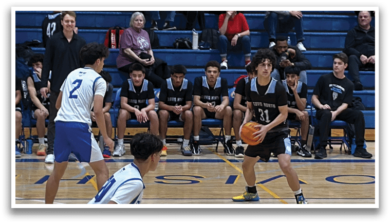 A group of people are watching a basketball game. A boy is holding a basketball and is about to shoot it. AI generated content
