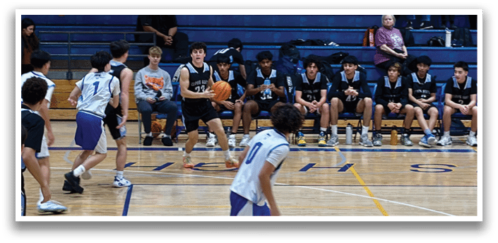 A group of young men playing basketball on a court. AI generated content