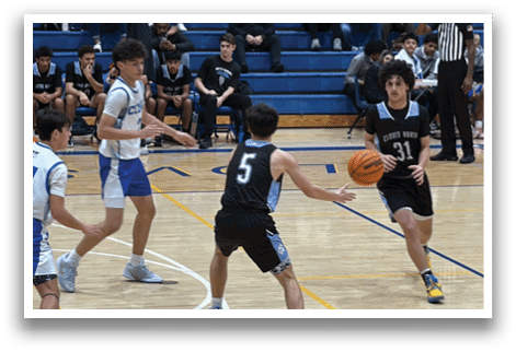 A group of young men playing basketball on a court. AI generated content