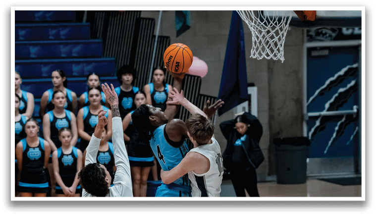 A group of people playing basketball, with one player attempting to block a shot. AI generated content