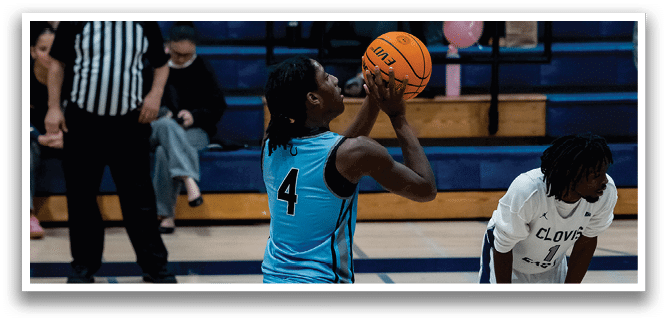 A man in a blue shirt is holding a basketball and preparing to shoot it. AI generated content
