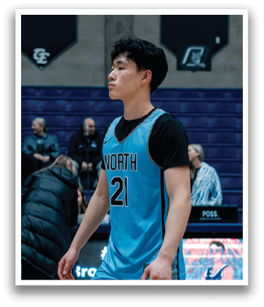 A basketball player wearing a blue jersey with the number 22 stands on the court. AI generated content