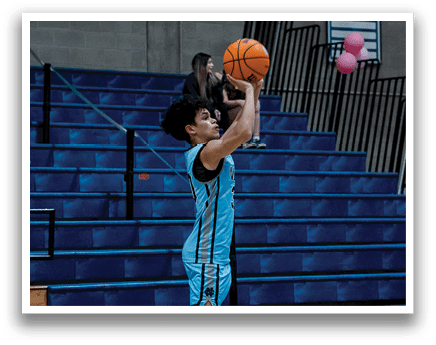 A basketball player jumps to catch a ball while others watch. AI generated content