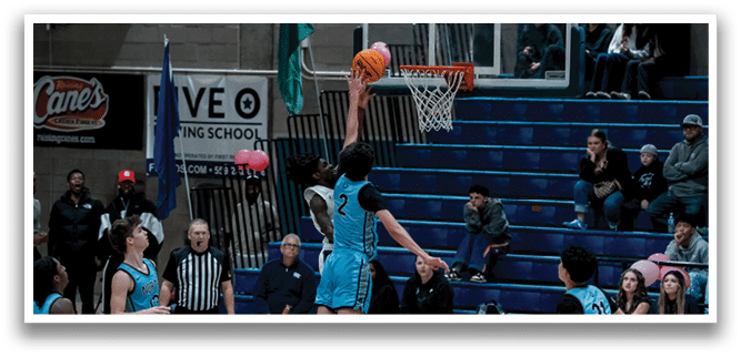 A basketball player jumps to block a shot, while the crowd watches intently. AI generated content