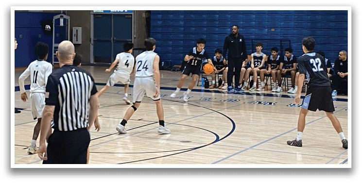 A group of young men playing basketball in a gym. AI generated content