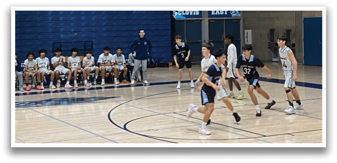 A group of young men playing basketball on a court. AI generated content