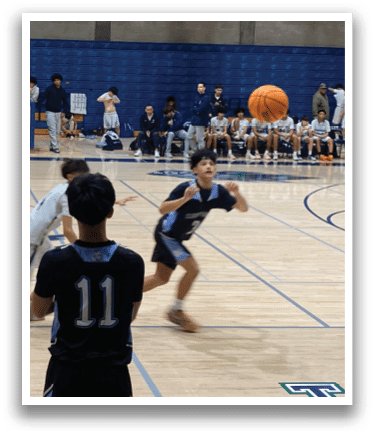 A group of people playing basketball on a court. AI generated content