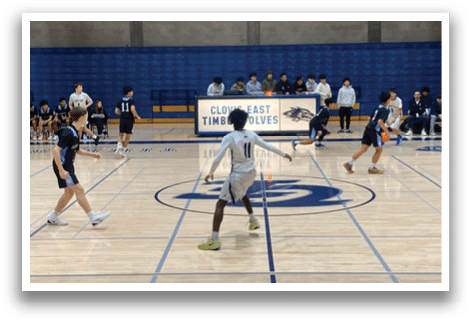 A group of people playing basketball on a court. AI generated content