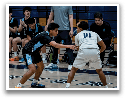 A basketball player is crouched down on the court, wearing a black jersey. AI generated content