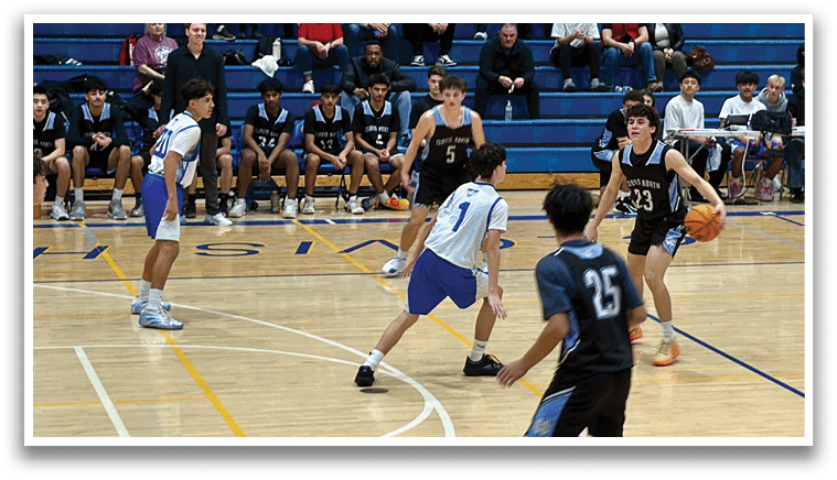 A group of young men playing basketball on a court. AI generated content