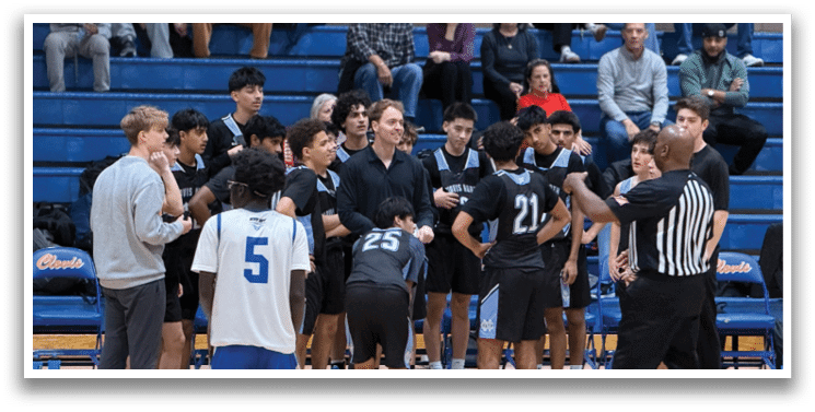 A group of people are gathered on a basketball court, with some players wearing uniforms and others in casual clothing. A referee is present, overseeing the game. The players are engaged in conversation, possibly discussing game strategies or sharing personal stories. The scene is lively and social, with everyone involved in the game or watching from the sidelines. AI generated content