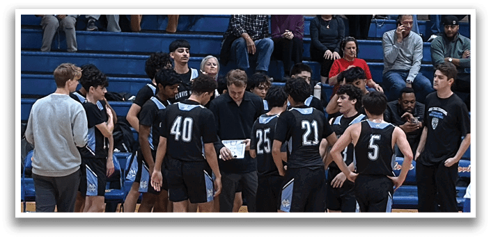 A group of young men are standing on a basketball court, holding their hands together. AI generated content