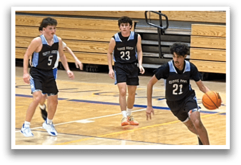 Three boys are playing basketball on a court. One of them is holding a basketball. AI generated content