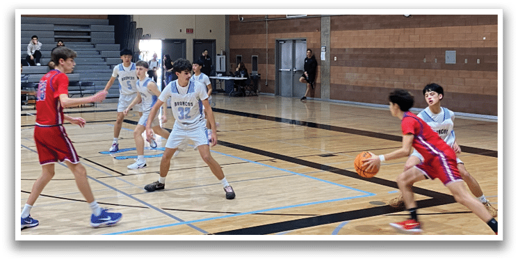 A group of young men playing basketball in a gym. AI generated content