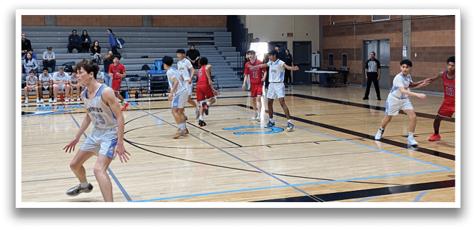 A group of young men playing basketball on a court. AI generated content