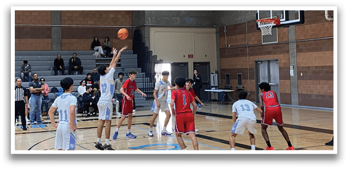 A group of young men playing basketball in a gym. AI generated content