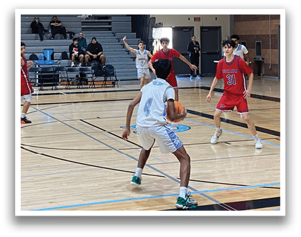 A group of young boys playing basketball in a gym. AI generated content