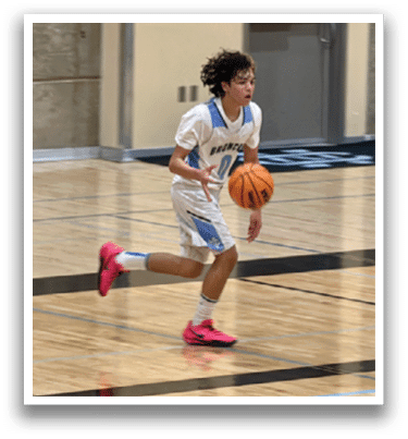 A basketball player in a white uniform is running with a basketball in his hand. AI generated content