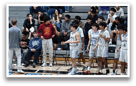A group of people are playing basketball on a court. AI generated content