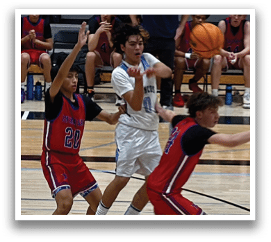 A group of young men playing basketball on a court. AI generated content