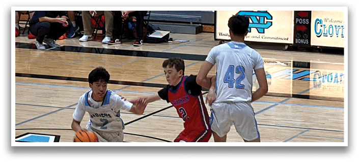 Three basketball players on a court, one holding a basketball. AI generated content