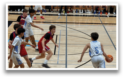 A group of young men playing basketball on a court. AI generated content