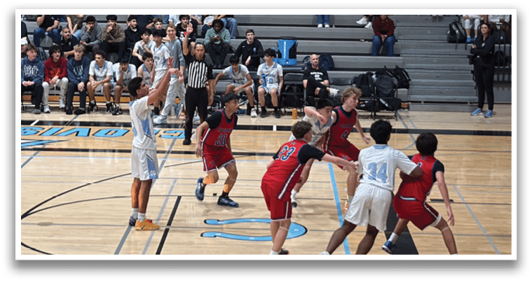 A group of young men playing basketball on a court. AI generated content