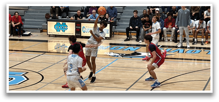 A group of people playing basketball on a court. AI generated content