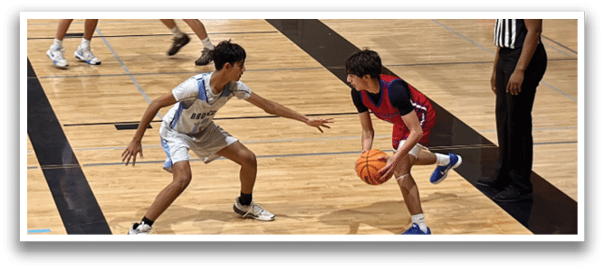 A group of young men playing basketball on a court. AI generated content
