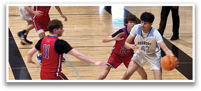 A group of young men playing basketball on a court. AI generated content