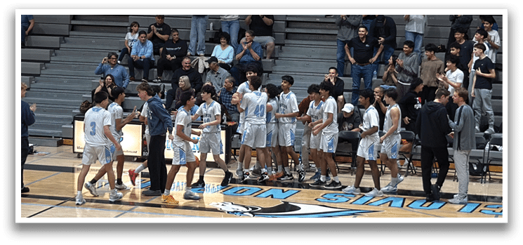 A group of people are standing on a basketball court, some of them holding their hands up. AI generated content