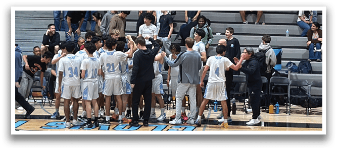 A group of people are sitting on a bench in a gym, watching a basketball game. AI generated content