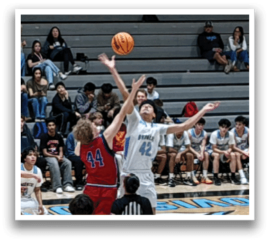 A group of people playing basketball on a court. AI generated content