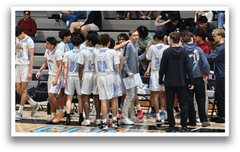 A group of young men are standing on a basketball court, wearing uniforms and holding their hands together. AI generated content