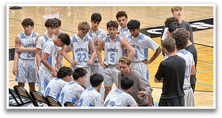 A group of young men are sitting on chairs, listening to a coach. AI generated content