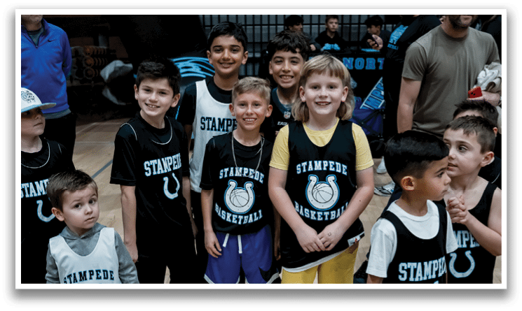 A basketball game is taking place in a gym with a crowd of people watching. The players are on the court, and there are several benches for the spectators. The gym is equipped with a scoreboard and a clock, and the atmosphere is lively. AI generated content