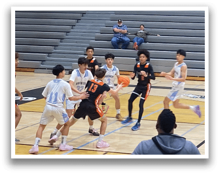 A group of people are sitting on a bench in a gym. A man in a black shirt is standing in front of them. AI generated content