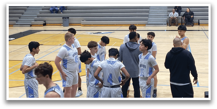 A group of young men are standing on a basketball court, wearing uniforms and waiting for the game to start. AI generated content