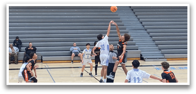 A group of young men playing basketball on a court. AI generated content
