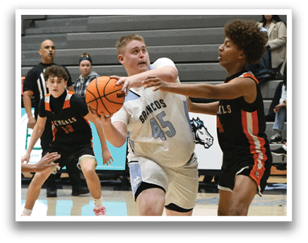 A group of people playing basketball on a court. AI generated content