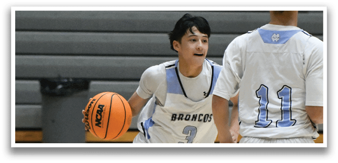 Two basketball players are running on a court, one holding a basketball. AI generated content