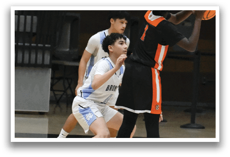 Two basketball players are playing on a court, one of them is holding a basketball. AI generated content